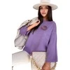 Moteriškas violetinis oversize megztinis Justi