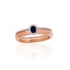 Auksinis žiedas su brangakmeniais. Metalas: Raudonas Auksas. Praba: 585°. Akmuo: Briliantai , Safyras - 17.5 - 3.43 g. - Briliantai (0,112Ct), Safyras (0,275Ct)