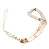 Guess pakabukas GUSTPEARW telefono dirželis baltos spalvos Heishi Beads