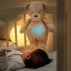 NATTOU Sleepy - dūzgiantis mielas žaislas su verksmo jutikliu 4in1 | Šuo Ecru