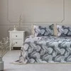 Lovatiesė 220×240 pilkos ir baltos spalvos tropinių lapų raštu DecoKing