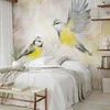 Artgeist Fototapetas - Painted tits - bird motif with patterns in yellow and beige tones