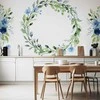 Artgeist Fototapetas - Romantic wreath - plant motif with mėlynas flowers and leaves