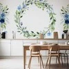 Artgeist Fototapetas - Romantic wreath - plant motif with mėlynas flowers and leaves