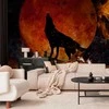 Artgeist Fototapetas - Wild nature - wolf on a background of a red moon in flames of fire