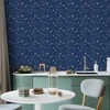 Artgeist Tapetas - Cosmic Fantasy - Pattern with Suns - Moons - and Dragonflies on a Dark Background.