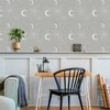 Artgeist Tapetas - Cosmic Fireworks - Elegant pattern with moons and stars on a pilka background.