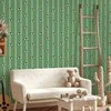 Artgeist Tapetas - Sports Whistles - Repeating pattern on a striped žalias background.