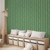 Artgeist Tapetas - Sports Whistles - Repeating pattern on a striped žalias background.