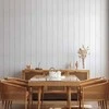 Artgeist Tapetas - Vertical Lines - Baltas background with a delicate wood pattern vertically.