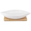 Regular divided dish made of cream porcelain 26x14x4 cm on a bamboo base 19.5x19.5x1 cm
