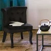 Juodas ketaus arbatinukas su varine rankena interjere