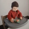 Mushie prilimpantis sukamasis žaislas (spinner) Dino
