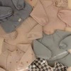 Mushie seilinukas su rankovėmis Blush