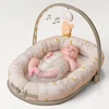 Taf Toys 2in1 kūdikio lavinamasis kilimėlis - lizdelis su žaidimų lanku Little Explorer, rusvai gelsvas