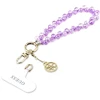 Dėklas Guess universalus riešo dirželis su kristalais 4G Charm violetinis