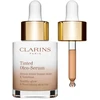 Clarins tonuotas makiažo pagrindas „Oleo Glow“ serumas 03, 30 ml