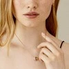 Daniel Wellington Stilingas bronzinis karoliai su apvaliu pakabuku Emalie DW00400305