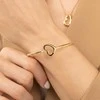 Hugo Boss Solid auksinis-plated bracelet with a heart Honey Boundless 1580724