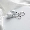 Lampglas Snow Nude dangle earrings with sterling sidabrinis ENM6/AG/RHO