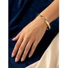 Marc Malone Elegant solid bracelet with clear crystals Doré MCB250400G