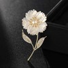 Troli Brooch with genuine pearl in flower and rhinestones Gold
