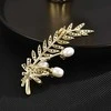 Troli Tender Branch brooch with genuine pearls and crystals Gold