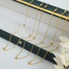 Troli Elegantiškas paauksuotas karoliai su cirkoniais VAAXP1692G