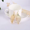 Troli Gold-plated earrings Laurel leaves with a bow tie Laurel