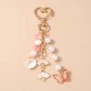 Troli Gold-plated handbag pendant Butterfly, fans and shells