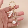 Troli Gold-plated pendant with crystals and synthetic pearls