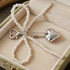 Troli Pearl handbag pendant Bow with heart