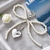 Troli Pearl handbag pendant Bow with heart