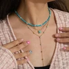 Troli Turquoise bead pakabukas with real pearls Gold