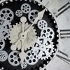 Eurofirany Baltai juodas sieninis laikrodis, 72 cm skersmuo, 8 cm gylis, plastiko ir stiklo konstrukcija, maitinamas baterijomis, dekoratyvinis laikrodis, didelis interjero akcentas
