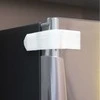 Buitinių prietaisų durelių apsauginis fiksatorius Dreambaby baltas