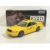 Greenlight Collectibles „Greenlight“ kolekcionuojami daiktai – 1/24 „Creed“ (2015 m.) – 1999 m. „Ford Crown Victoria Philly Taxi“