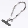 UNIQ Coehl Candy Gem Handstrap universal phone strap for hand sidabro spalvos/sidabro spalvos spar