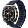 „Spigen“ medžiaginis dirželis (su lipdukais), tamsiai mėlynas – „Samsung Galaxy Watch Ultra 47mm“