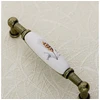 Porcelain handle 728B C=96mm antique brass K-wheet
