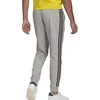 Adidas Essentials Kelnės su siaurėjančiais rankogaliais ir 3 juostelėmis M GK8889