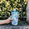 „Quokka Mist“ – nerūdijančio plieno termo puodelis 720 ml su šiaudeliu (violetinių žiedų)