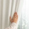 Užuolaida su klostėmis smėlio spalvos lininio audinio
