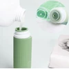 4 SILIKONINIŲ BUTELIŲ KELIONINĖS INDĖLIŲ RINKINYS 100ml ŽALIAI RUDA