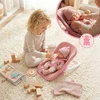 BABY Doll 30 cm NEŠĖLIŲ SĖDYNĖS KINDERPLAY ROŽINIŲ DRABUŽIŲ RINKINYS