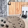 Bez Marki Okrągły sensoryczny dywan DINOZAURY 3D 133cm smėlio spalva NOYA Design