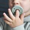 Dinaminis silikoninis čiulptukas MinikOiOi 2 vnt. Žalias kūdikiams 0-24m