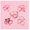 MAKE IT REAL Juicy Couture Surprise apyrankės su pakabukais 3 vnt.