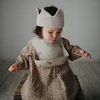 „Mushie“ silikoninis seilinukas su alyvinių gėlių kišene