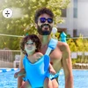 Neopreno nešynė kūdikiui baseine, paplūdimyje, vandenyje ir žemėje